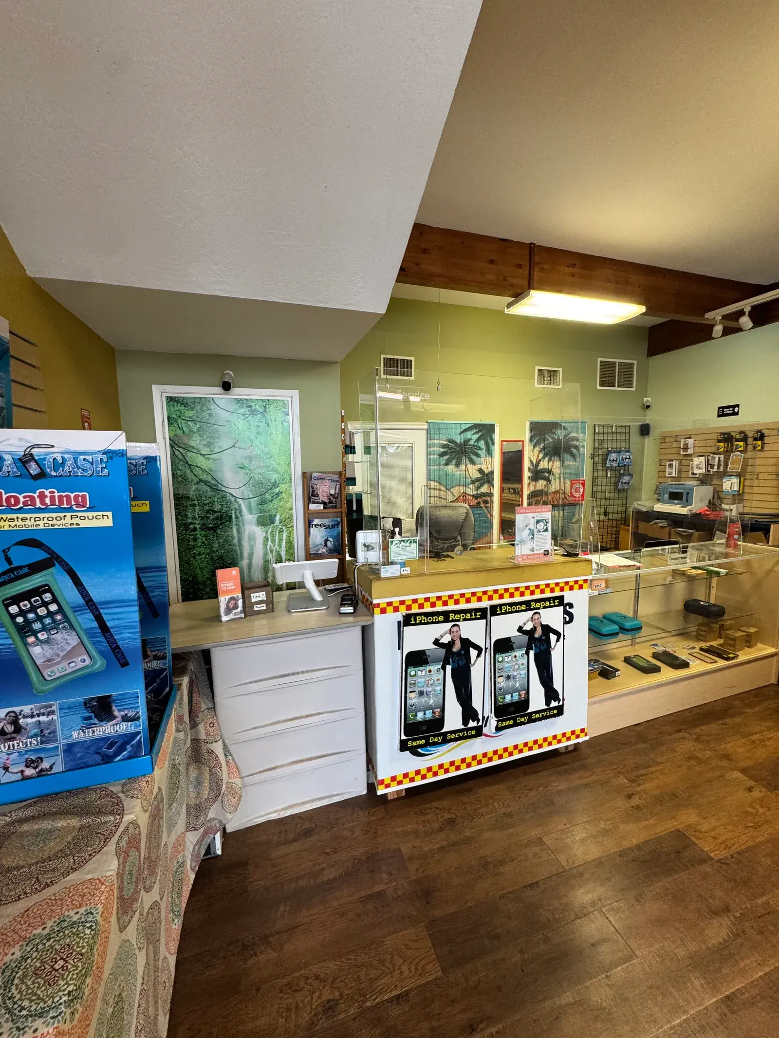 Front counter and display cases at Maui Cell Phone Repair
