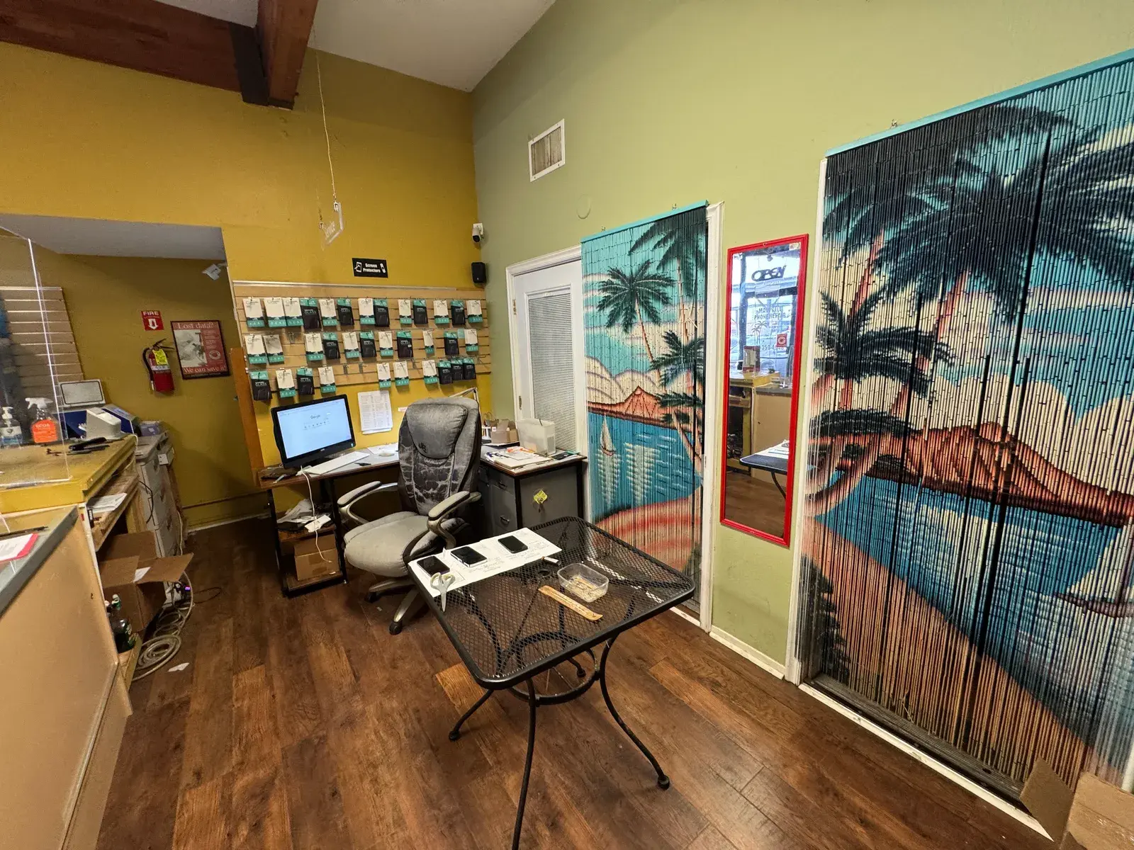 The front desk and the mural inside the shop